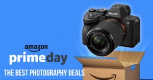 A Sony camera hovers above an open Amazon shipping box on a blue background with text that reads, “amazon prime day THE BEST PHOTOGRAPHY DEALS.”.