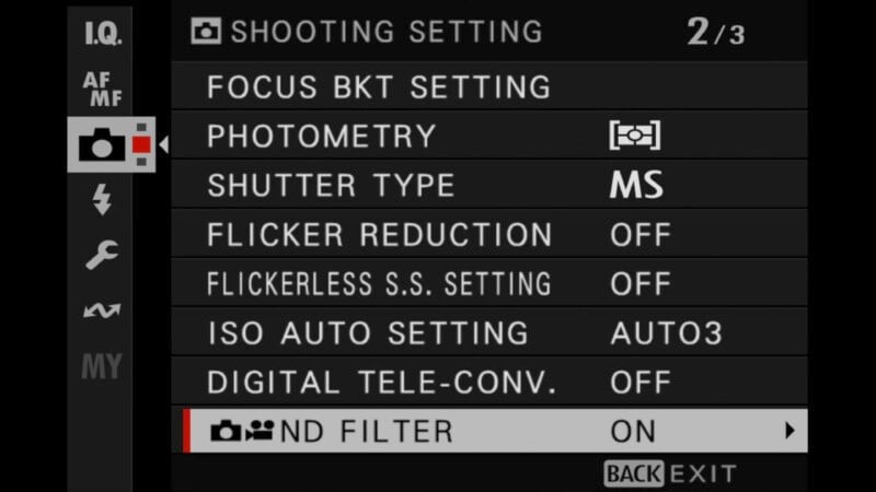 Camera menu screen displaying shooting settings options, including Focus BKT Setting, Photometry, Shutter Type (MS), Flicker Reduction (Off), Flickerless S.S. Setting (Off), ISO Auto Setting (Auto3), Digital Tele-Conv. (Off), and ND Filter (On).
