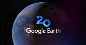 The image shows a view of Earth from space with a shadow dividing day and night, overlaid with a "20" and the text "Google Earth," celebrating Google Earth's 20th anniversary.
