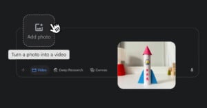 A computer screen shows a “Add photo” button with a hand cursor hovering over it, and a preview image of a toy rocket with blue fins and a red top on a white surface.