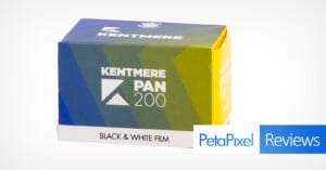 A box of Kentmere Pan 200 black & white film with green, blue, and yellow packaging. The box is angled, showing the film name and logo. "Petapixel Reviews" is overlaid in the bottom right corner.