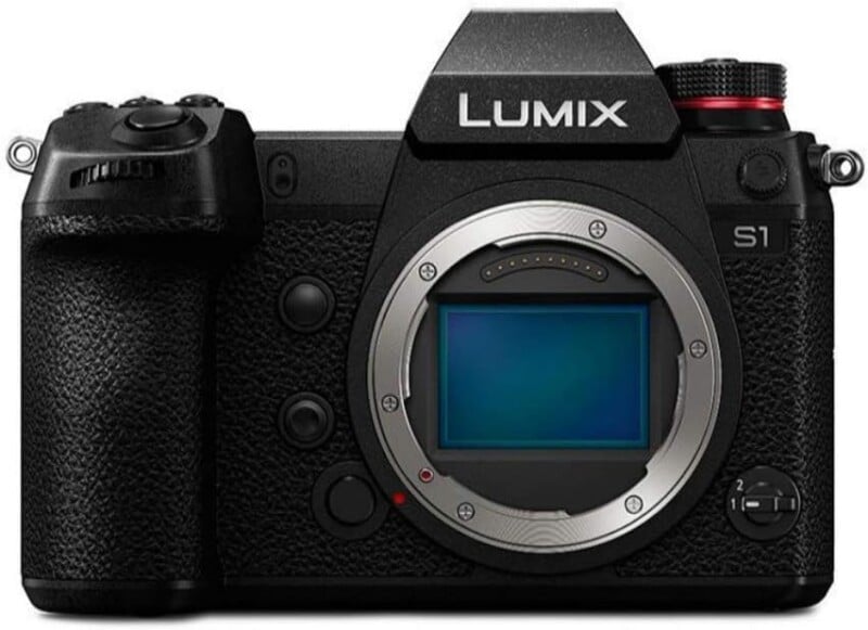 A black Panasonic Lumix S1 mirrorless digital camera body is shown without a lens, displaying its exposed sensor and textured grip.