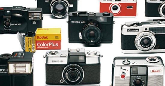 A variety of vintage film cameras from different brands are arranged on a white background, along with a Kodak ColorPlus 35mm film roll and a yellow film box.